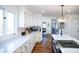 Bright, updated kitchen with expansive countertops, stainless appliances, and hardwood floors at 48 Blue Heron Ln, Roxboro, NC 27574