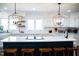 Beautiful kitchen island with white countertops, pendant lighting, and modern appliances at 48 Blue Heron Ln, Roxboro, NC 27574