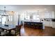 Spacious kitchen with island, barstool seating, stainless steel appliances, and modern pendant lighting at 48 Blue Heron Ln, Roxboro, NC 27574