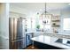 Well-equipped kitchen featuring stainless steel appliances, farm sink, and ample counter space at 48 Blue Heron Ln, Roxboro, NC 27574
