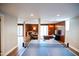 Open-concept living area with a ping pong table leading to the living room at 48 Blue Heron Ln, Roxboro, NC 27574