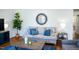 Cozy living room with a comfortable couch, stylish accents, and natural light, ideal for relaxing or entertaining at 48 Blue Heron Ln, Roxboro, NC 27574