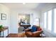 Living room with seating area leading to game room and kitchen at 48 Blue Heron Ln, Roxboro, NC 27574