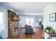 Living room showcasing a stone fireplace, hardwood floors, and comfortable seating arrangement at 48 Blue Heron Ln, Roxboro, NC 27574