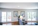 Bright living room with access to outdoor deck, comfortable seating, and natural light create an inviting space at 48 Blue Heron Ln, Roxboro, NC 27574