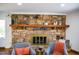 Comfortable living room features a stone fireplace and cozy seating, perfect for relaxation and Gathering time at 48 Blue Heron Ln, Roxboro, NC 27574