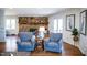 Spacious living area featuring a stone fireplace, comfortable seating, and an open layout perfect for gatherings at 48 Blue Heron Ln, Roxboro, NC 27574