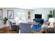 Bright living room with stylish furnishings, hardwood floors, and access to a deck at 48 Blue Heron Ln, Roxboro, NC 27574