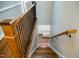 This staircase features wood steps, wooden handrail, and black metal spindles at 48 Blue Heron Ln, Roxboro, NC 27574