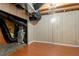 Basement area features hardwood floors, panelled walls, and exposed mechanicals and ventilation at 5036 Isabella Cannon Dr, Raleigh, NC 27612