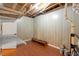 Unfinished basement with a painted floor, white walls, and visible utilities and storage shelving at 5036 Isabella Cannon Dr, Raleigh, NC 27612