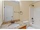 Well-lit bathroom featuring granite countertops, a built-in bathtub, and updated fixtures at 5036 Isabella Cannon Dr, Raleigh, NC 27612