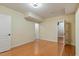 Spacious bedroom with hardwood floors and neutral walls, two doors, and recessed lighting at 5036 Isabella Cannon Dr, Raleigh, NC 27612