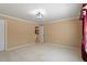 Bedroom boasts carpeted floors, neutral colored walls, and a window with elegant curtains at 5036 Isabella Cannon Dr, Raleigh, NC 27612