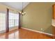 Cozy breakfast nook with large windows and natural light with chandelier at 5036 Isabella Cannon Dr, Raleigh, NC 27612