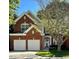 Beautiful two-story red brick home with a two-car garage and manicured lawn at 5036 Isabella Cannon Dr, Raleigh, NC 27612