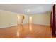 Open-concept living room with hardwood floors and a staircase, perfect for entertaining at 5036 Isabella Cannon Dr, Raleigh, NC 27612
