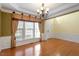 Cozy living room with natural light, hardwood floors, and neutral color palette at 5036 Isabella Cannon Dr, Raleigh, NC 27612