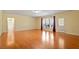 Bright and spacious living room featuring beautiful hardwood floors and large windows at 5036 Isabella Cannon Dr, Raleigh, NC 27612