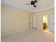 Spacious main bedroom with light yellow walls and doorway access to the bathroom at 5036 Isabella Cannon Dr, Raleigh, NC 27612