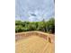 New wood back deck with black metal railings and natural background at 60 Moonraker Dr, Spring Hope, NC 27882