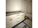 Bathroom featuring double vanity with stone countertop and white cabinets at 60 Moonraker Dr, Spring Hope, NC 27882