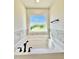Inviting bathtub offers a relaxing retreat with a view and modern fixtures at 60 Moonraker Dr, Spring Hope, NC 27882