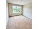 Bright bedroom featuring a window with scenic outdoor views and trim molding along the ceiling at 60 Moonraker Dr, Spring Hope, NC 27882