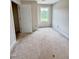Bedroom with one window, beige walls and unfinished floors at 60 Moonraker Dr, Spring Hope, NC 27882