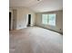 Bedroom with neutral walls, large window with lots of natural light and unfinished floors at 60 Moonraker Dr, Spring Hope, NC 27882
