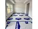 A dining room with light colored wood flooring, trey ceilings and a window at 60 Moonraker Dr, Spring Hope, NC 27882