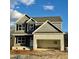New two-story home with stone garage, covered entry, and traditional architecture at 60 Moonraker Dr, Spring Hope, NC 27882