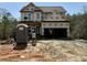 New home construction featuring an attached two car garage and covered front porch at 60 Moonraker Dr, Spring Hope, NC 27882