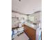 Modern kitchen with white cabinets, white subway tile, granite counters, stainless appliances and an island at 60 Moonraker Dr, Spring Hope, NC 27882