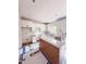 Modern kitchen with white cabinets, white subway tile, granite counters, stainless appliances and an island at 60 Moonraker Dr, Spring Hope, NC 27882