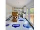 Modern kitchen with white cabinets, white subway tile, granite counters, stainless appliances and a deck at 60 Moonraker Dr, Spring Hope, NC 27882