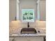 Granite counters and stainless steel sink are complemented by a view of lush greenery at 60 Moonraker Dr, Spring Hope, NC 27882