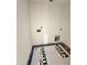 Spacious laundry room with convenient hookups and a protective barrier on the hardwood floor at 60 Moonraker Dr, Spring Hope, NC 27882