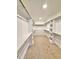 Spacious walk-in closet with ample shelving and clothing rods at 60 Moonraker Dr, Spring Hope, NC 27882