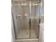 Tiled bathroom features a spacious shower with glass doors and modern fixtures at 6002 River Estates Dr, Knightdale, NC 27545