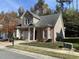 Well-maintained home boasts brick accents, a two-car garage, and mature trees at 6002 River Estates Dr, Knightdale, NC 27545