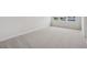 Neutral bedroom featuring carpet, a window providing natural light, and painted walls at 607 Callan View Ave, Wake Forest, NC 27587