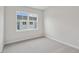 Neutral bedroom featuring carpet, a window providing natural light, and painted walls at 607 Callan View Ave, Wake Forest, NC 27587