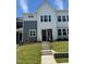 Charming two-story home with a modern farmhouse design, featuring gray and white siding and a well-manicured lawn at 607 Callan View Ave, Wake Forest, NC 27587