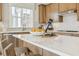Bright kitchen with large island, quartz countertops, stainless steel appliances, and a breakfast bar at 607 Callan View Ave, Wake Forest, NC 27587