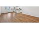 Open-concept living room and kitchen with hardwood flooring and stainless steel appliances at 607 Callan View Ave, Wake Forest, NC 27587