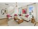 Inviting living room with large windows, neutral tones, stylish decor, and staircase at 607 Callan View Ave, Wake Forest, NC 27587