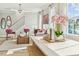 Bright and airy living area featuring a dining table and chairs, a comfortable sofa, and large windows offering natural light at 607 Callan View Ave, Wake Forest, NC 27587