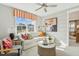 Comfortable living room with a plush sofa, accent chairs, and an abundance of natural light at 607 Callan View Ave, Wake Forest, NC 27587