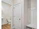 Convenient mudroom with built-in bench, storage cubbies, and adjacent powder room at 607 Callan View Ave, Wake Forest, NC 27587